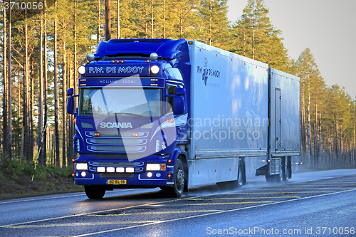 Image of Blue Scania Flower Transport Truck on the Road