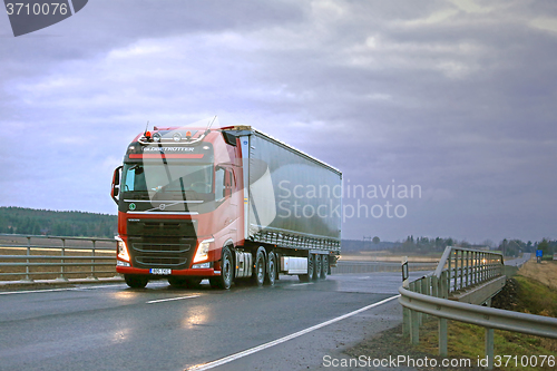 Image of Red Volvo FH Semi and Dark Sky