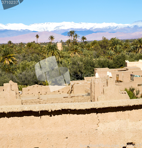 Image of brown  tower  old  construction in  africa morocco and  clouds  