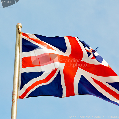 Image of waving flag in the blue sky british colour and wave
