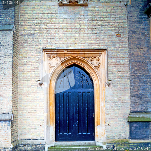 Image of brown wooden parliament in london old  door and marble antique  