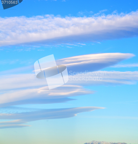 Image of in the blue sky white soft clouds and abstract background