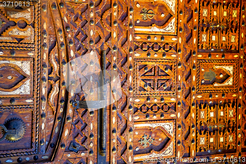 Image of grey metal rusty      morocco in africa the old wood  padlock 