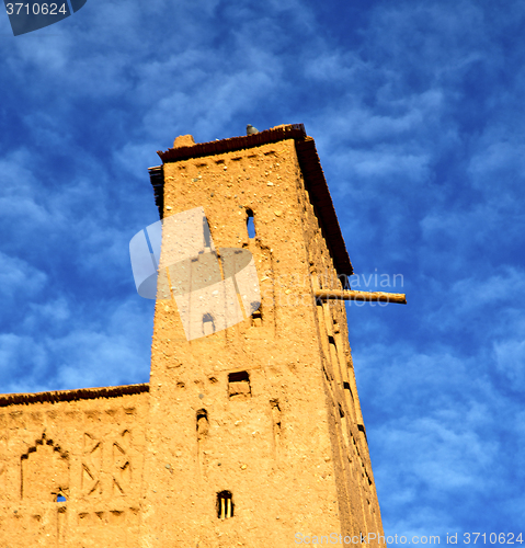 Image of africa  in histoycal maroc  old construction  and the blue cloud