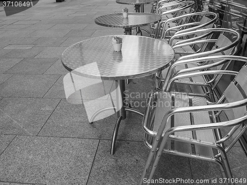 Image of Black and white Tables and chairs