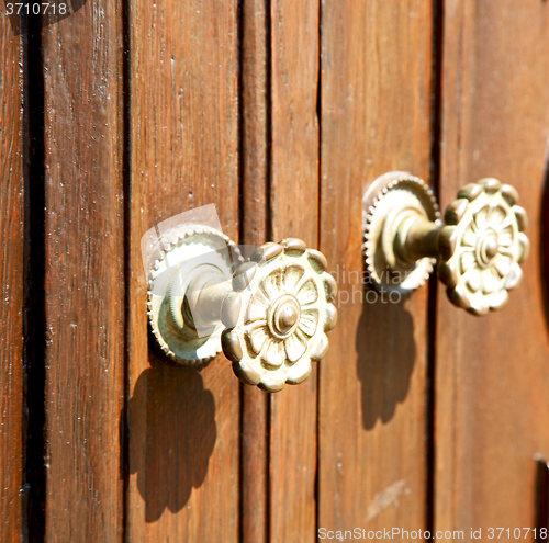 Image of stripped paint  door    in italy   ancian wood and traditional  