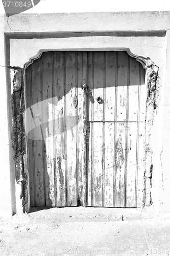 Image of blue door in antique village santorini greece europe and    whit