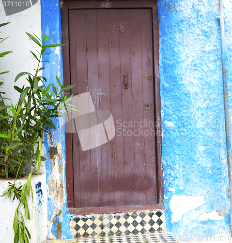 Image of historical blue  in  antique building door morocco      style af