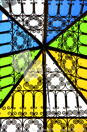 Image of colorated glass  sun in  window and light