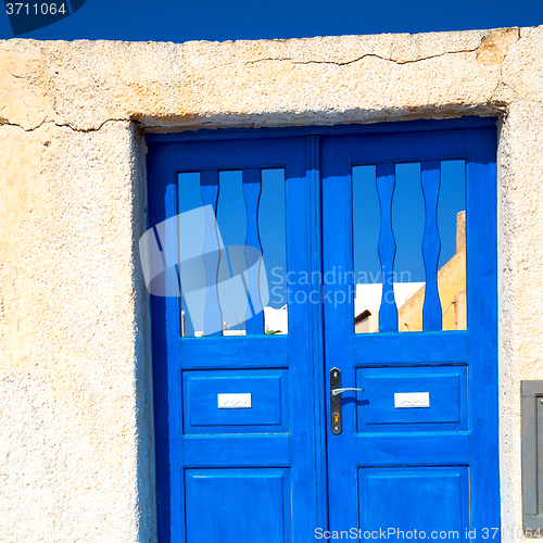 Image of blue door in antique village santorini greece europe and white w