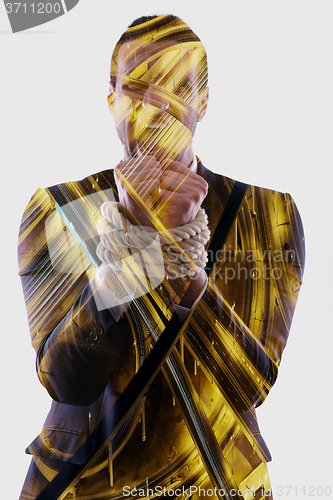 Image of double exposure of business man with rope isolated on white back