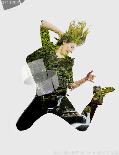 Image of double exposure of nature and  young woman dancing