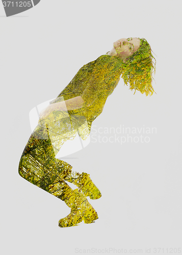 Image of double exposure of nature and  young woman dancing