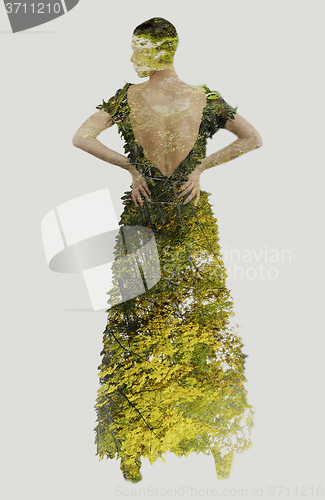 Image of double exposure of elegant woman in fashionable dress posing in 