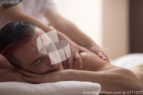 Image of man have relaxing massage