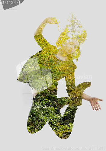 Image of double exposure of nature and  young woman dancing