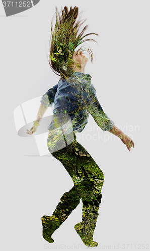 Image of double exposure of nature and  young woman dancing