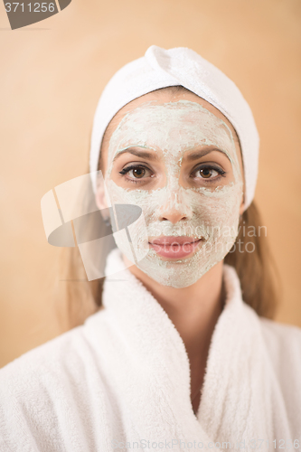 Image of woman in spa  with cosmetic mask