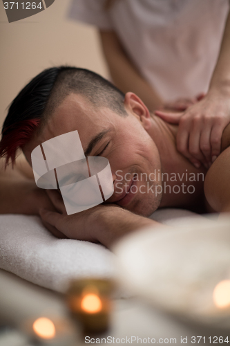 Image of man have relaxing massage