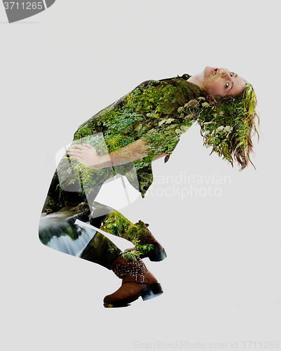 Image of double exposure of nature and  young woman dancing