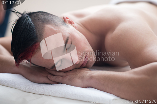 Image of man have relaxing massage