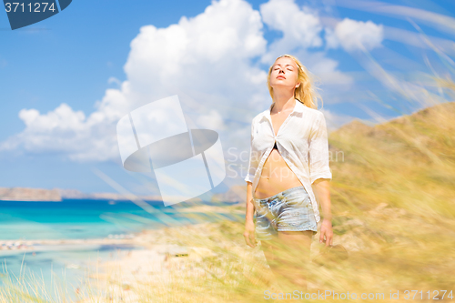 Image of Free Happy Woman Enjoying Sun on Vacations.