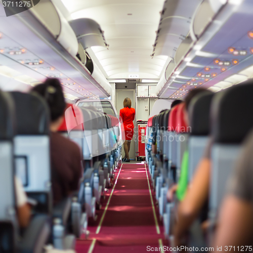 Image of Stewardess on the airplane.