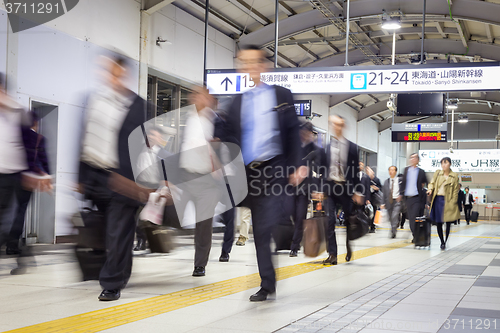 Image of Business people traveling by Tokyo metro.