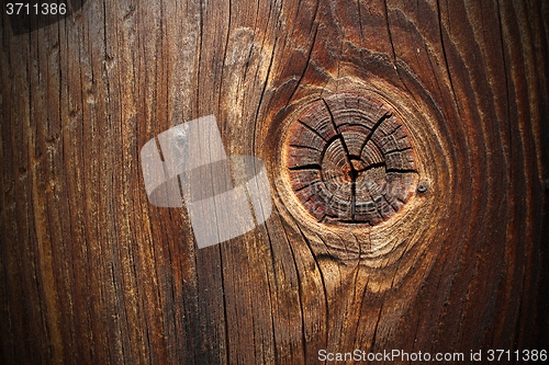 Image of big knot on spruce plank