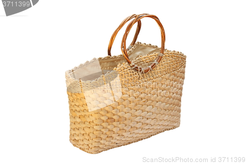 Image of wicker handbag over white