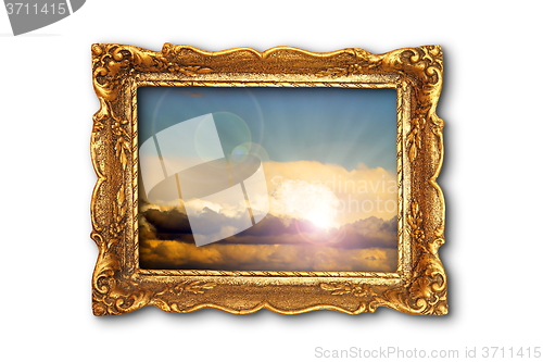 Image of colorful sky image in ancient gilded painting frame