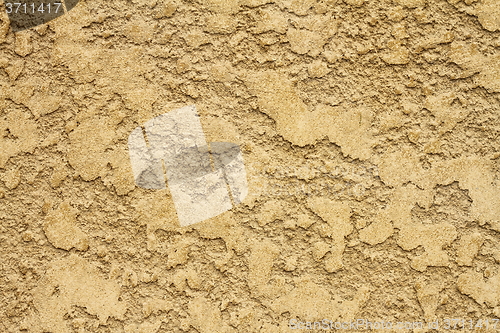 Image of grungy yellow plaster real texture