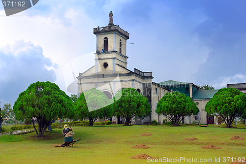 Image of Filipino village scene with church.