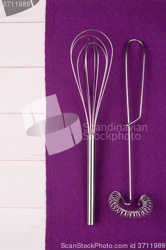 Image of Kitchenware on purple towel