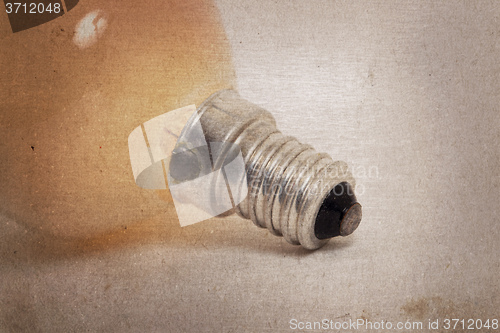 Image of Old orange lightbulb isolated on a white background