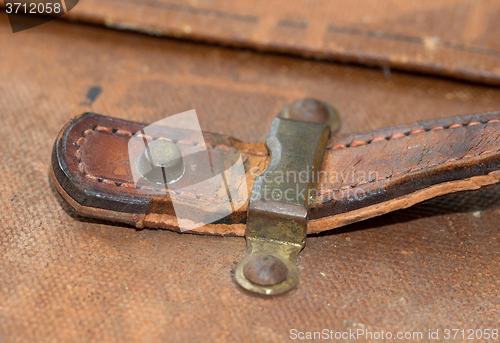 Image of Old canvas trunk handle close up