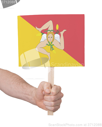 Image of Hand holding small card - Flag of Sicily