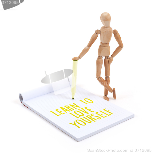 Image of Wooden mannequin writing - Learn to love yourself