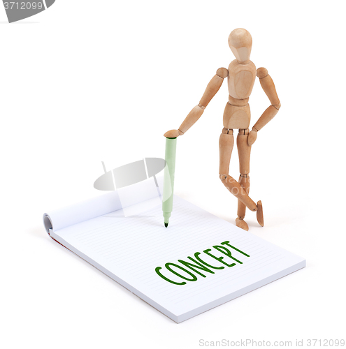 Image of Wooden mannequin writing - Concept