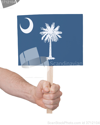 Image of Hand holding small card - Flag of Oklahoma