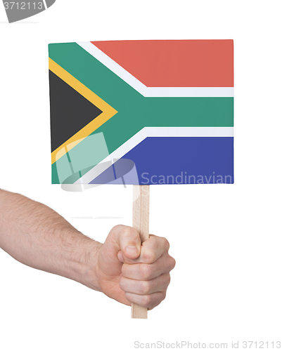 Image of Hand holding small card - Flag of South Africa