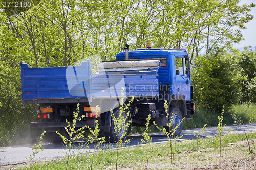 Image of Blue truck in the countryside