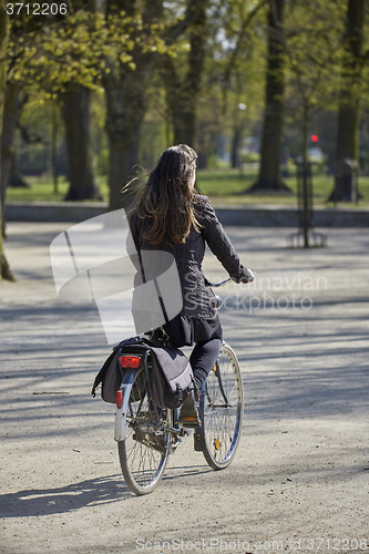 Image of Woman on the bicycle in the park