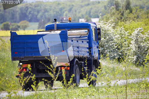 Image of Blue truck in the countryside