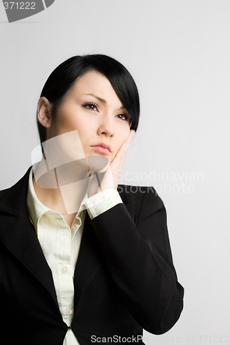 Image of Daydreaming businesswoman