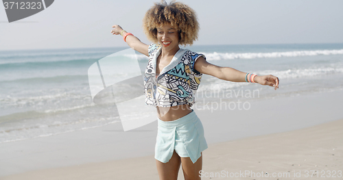 Image of Girl Jumping With Joy On The Seashore