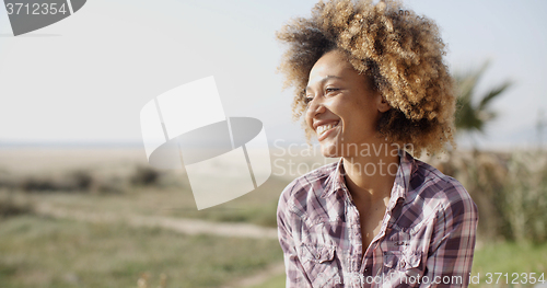 Image of Young Smiling Woman Outdoors