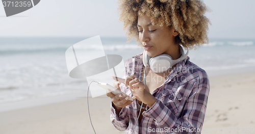 Image of Gorgeous Girl Listening To Music