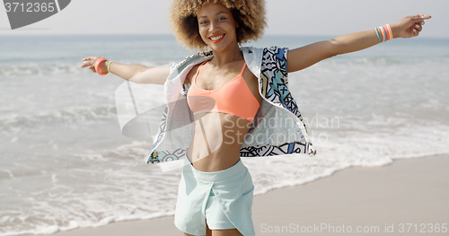 Image of Jumping Happy Girl On The Beach