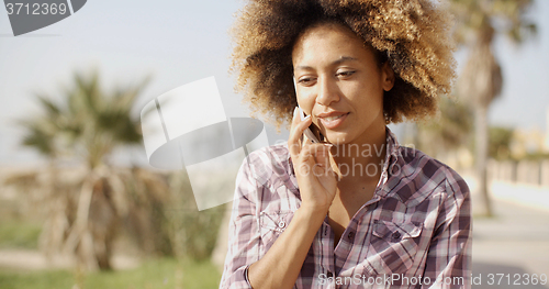 Image of Smiling Woman Talking On Cell Phone